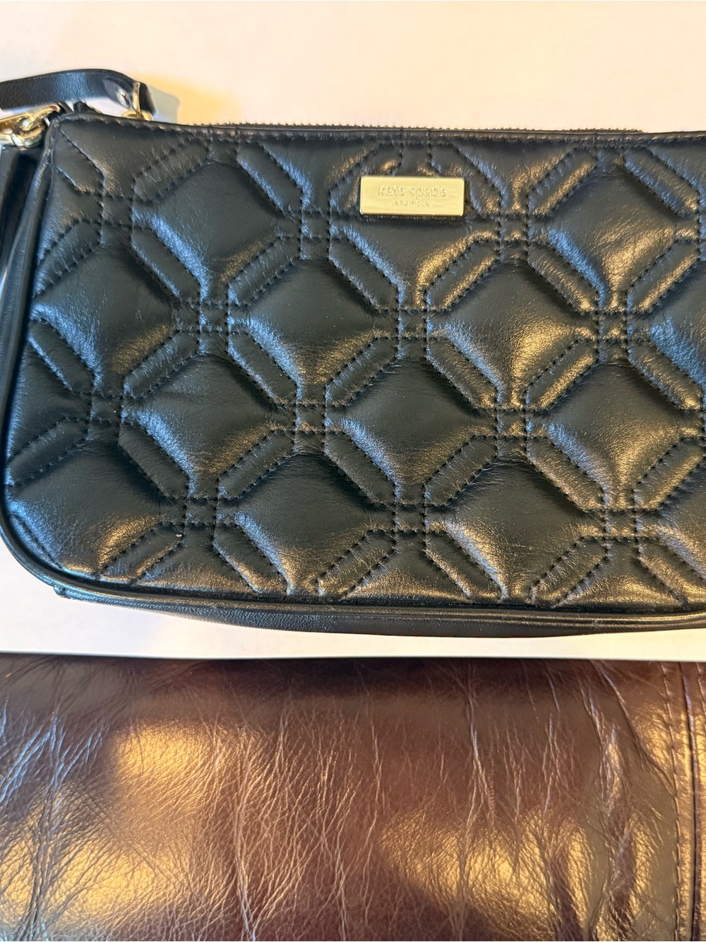 kate spade Black Quilted Leather Wristlet with Gold Plaque